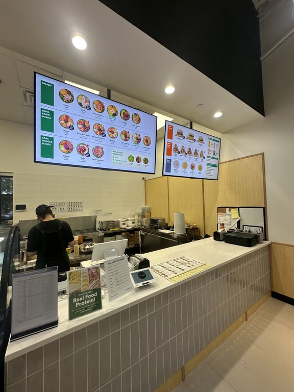 The order counter and lit menu boards at Salady Parker on opening day