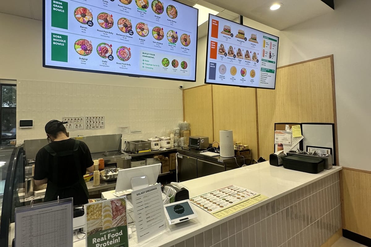The order counter and lit menu boards at Salady Parker on opening day