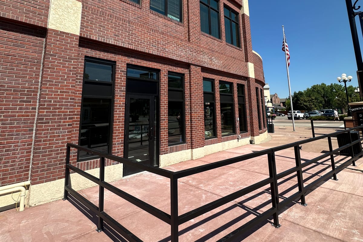 SuBourbon on Main under construction in downtown Parker, with the patio railing going in along Mainstreet in July 2026