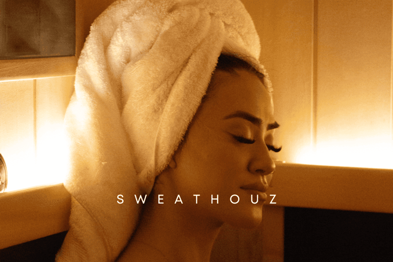 SweatHouz infrared sauna suite in warm light — coming soon to Highlands Ranch, Colorado