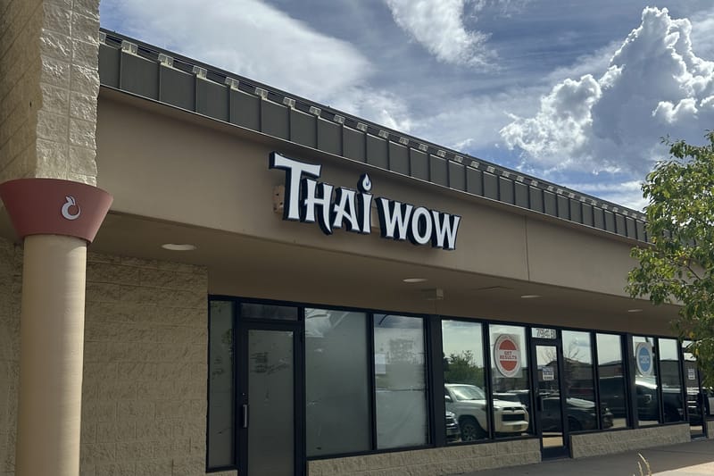 Thai Wow's sign up over the still-papered storefront at 794 S Perry Street in the Plum Creek Safeway center, September 2026.