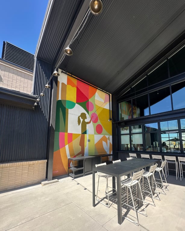 Exterior mural by Magik Studios at The Groove, Lyric at RidgeGate in Lone Tree