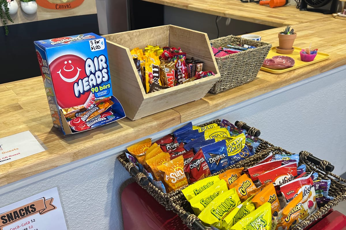 Self-serve snack station with candy and drinks at The Hot Spot Studios in Castle Rock