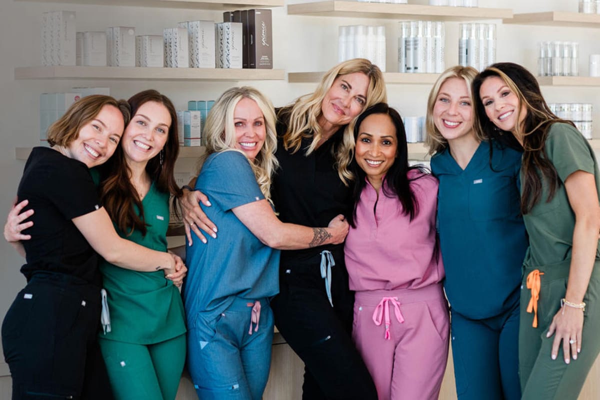 The Skin Company team in scrubs in the skincare retail area