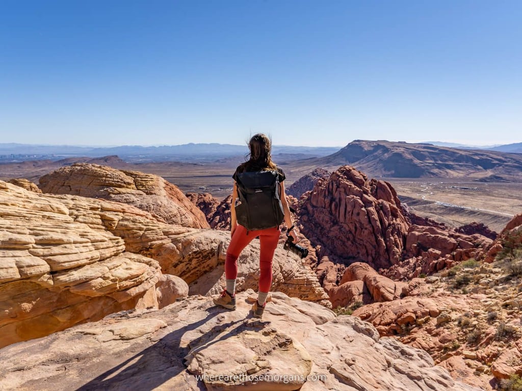 A Woman standing on top of Red Canyon