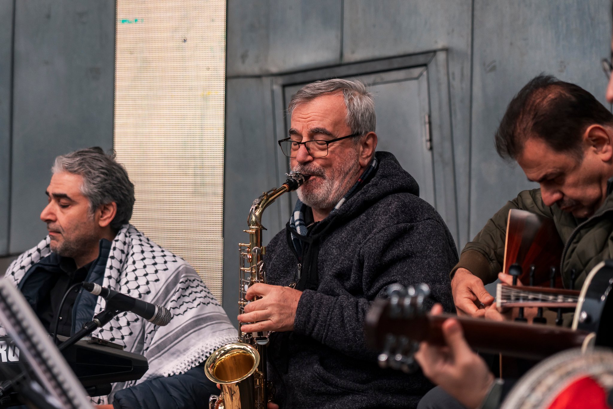 Arab classical music orchestra Tarab Ensemble performs on stage.