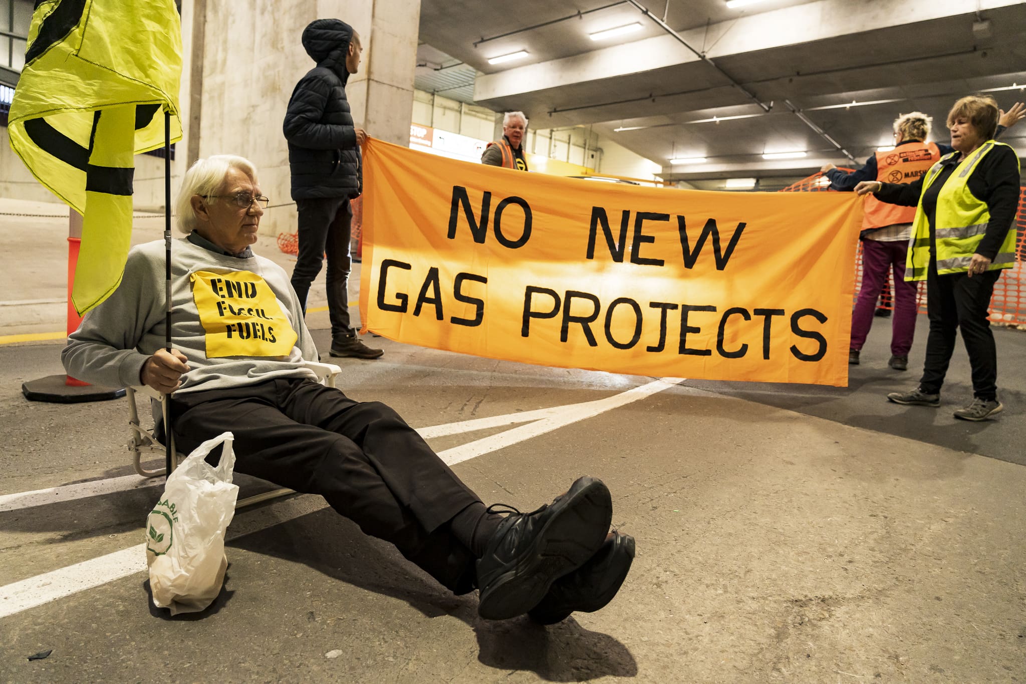 Protesters hold up and coming traffic at the Adelaide Convention Centre, preventing APPEA delegates from arriving by car. Photo: Matt Hrkac
