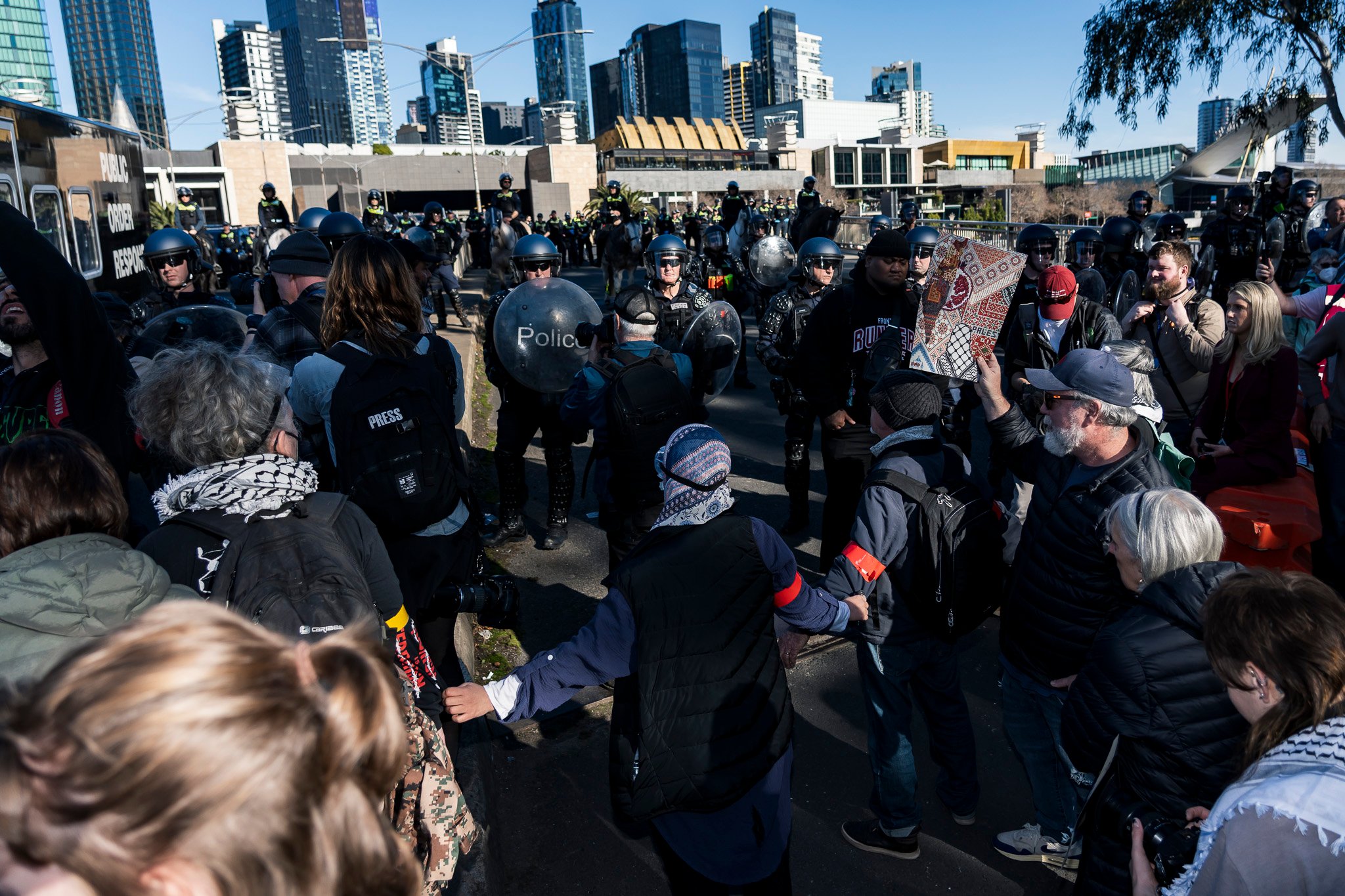 The march was met with dozens of Public Order Response Team (PORT) members in riot control gear.