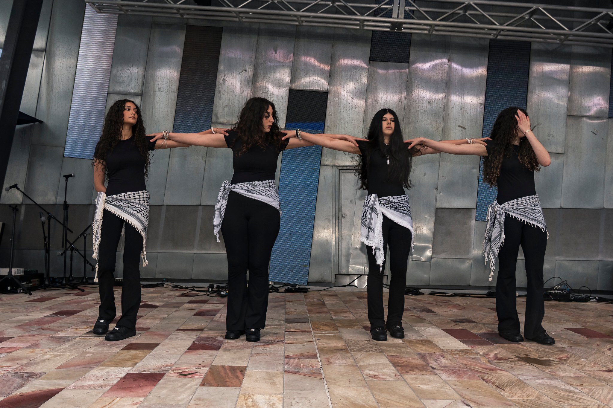 Children's dabke performance on stage.