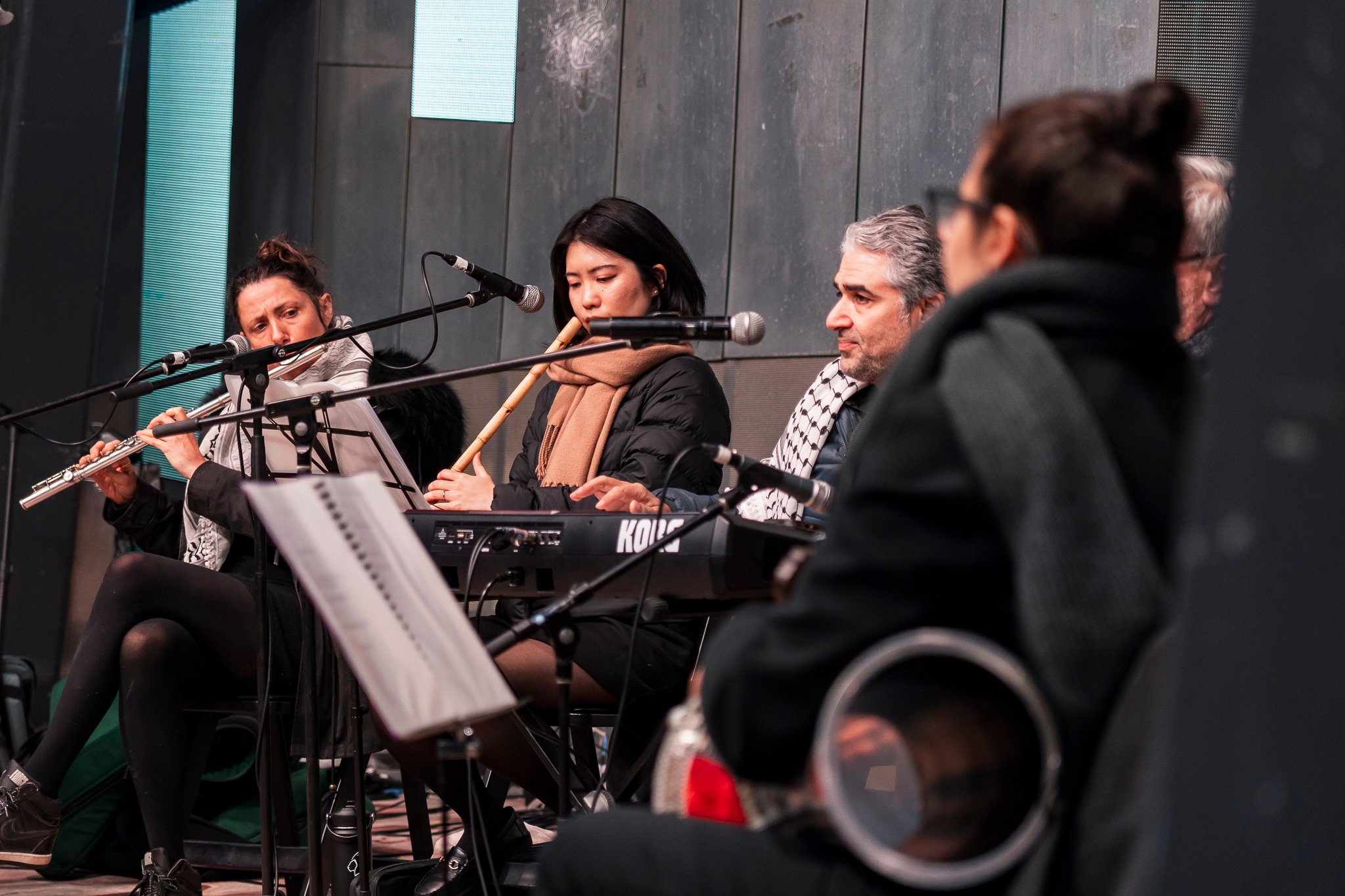 Arab classical music orchestra Tarab Ensemble performs on stage.