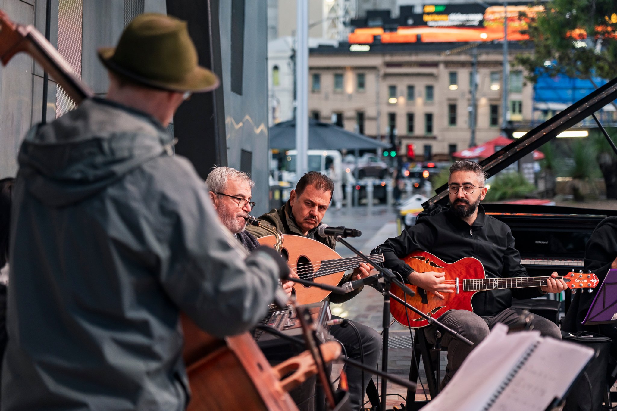 Arab classical music orchestra Tarab Ensemble performs on stage.