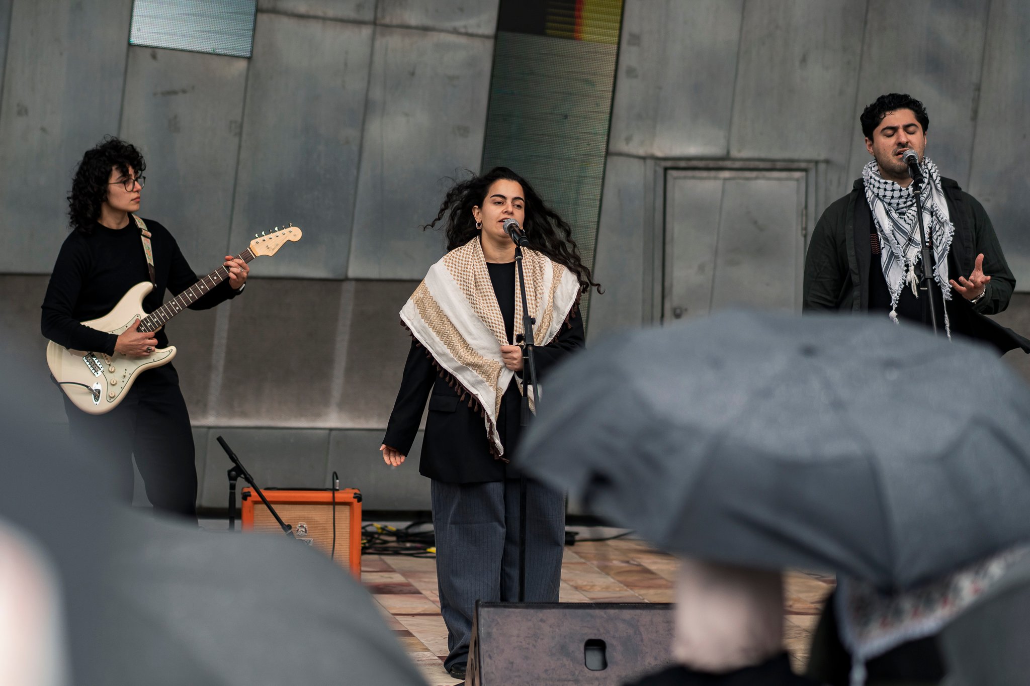 Arab music band Watar Music Ensemble performs on stage.