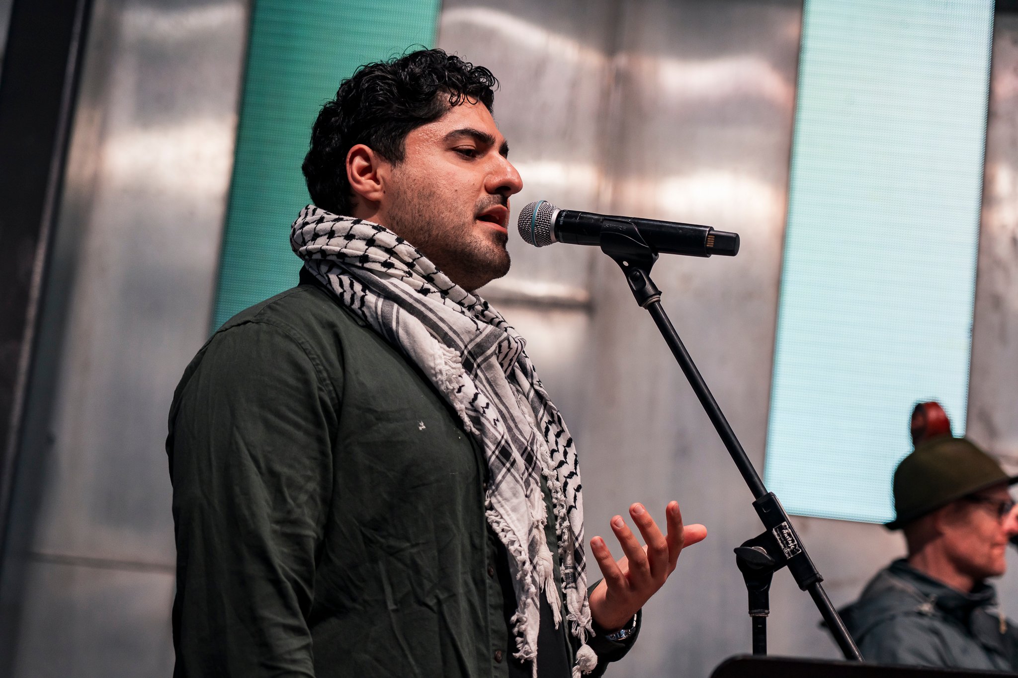 Arab classical music orchestra Tarab Ensemble performs on stage.