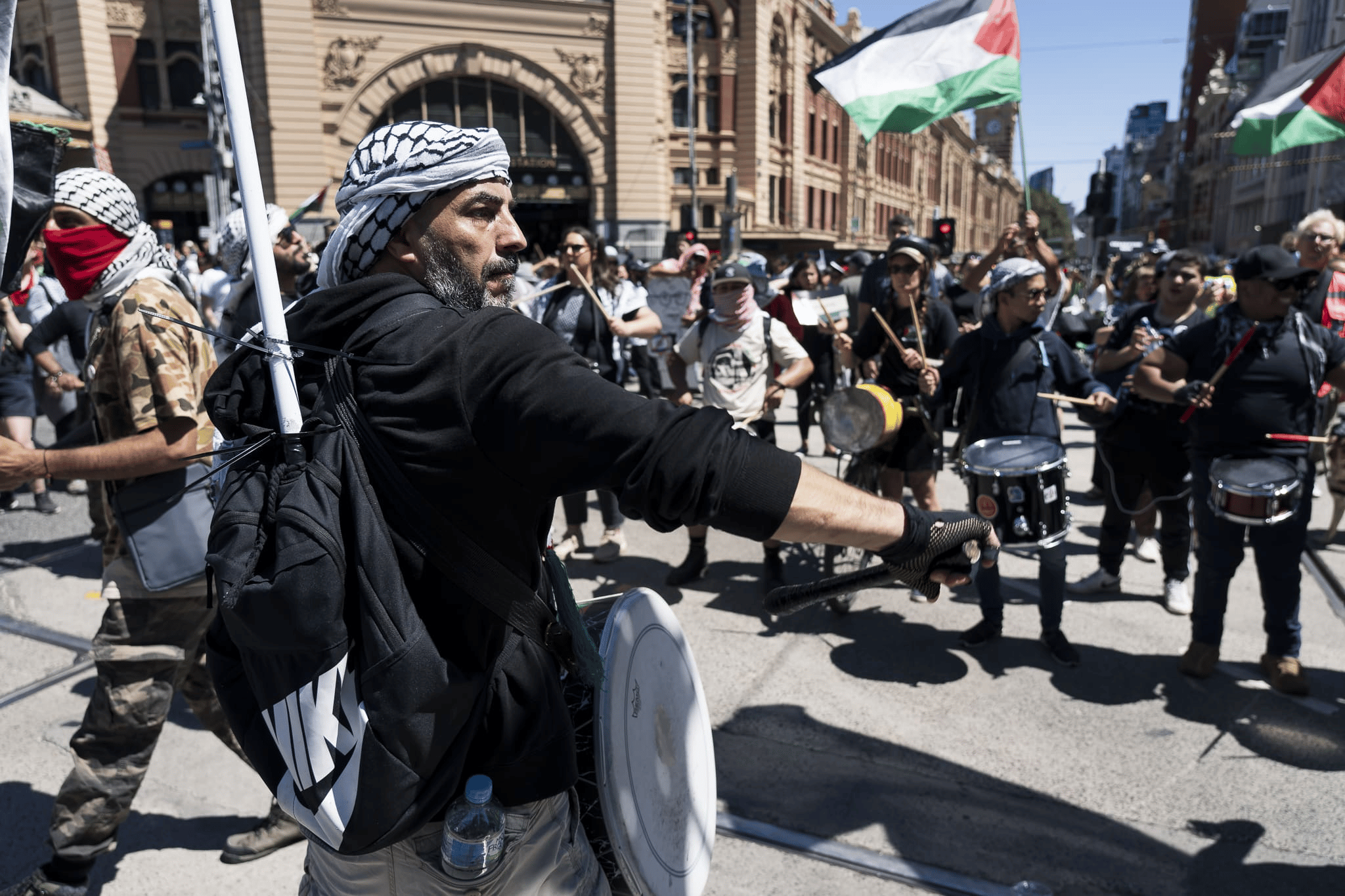 Drummers leading chants at the Palestine rally in Melbourne. Photo: Matt Hrkac