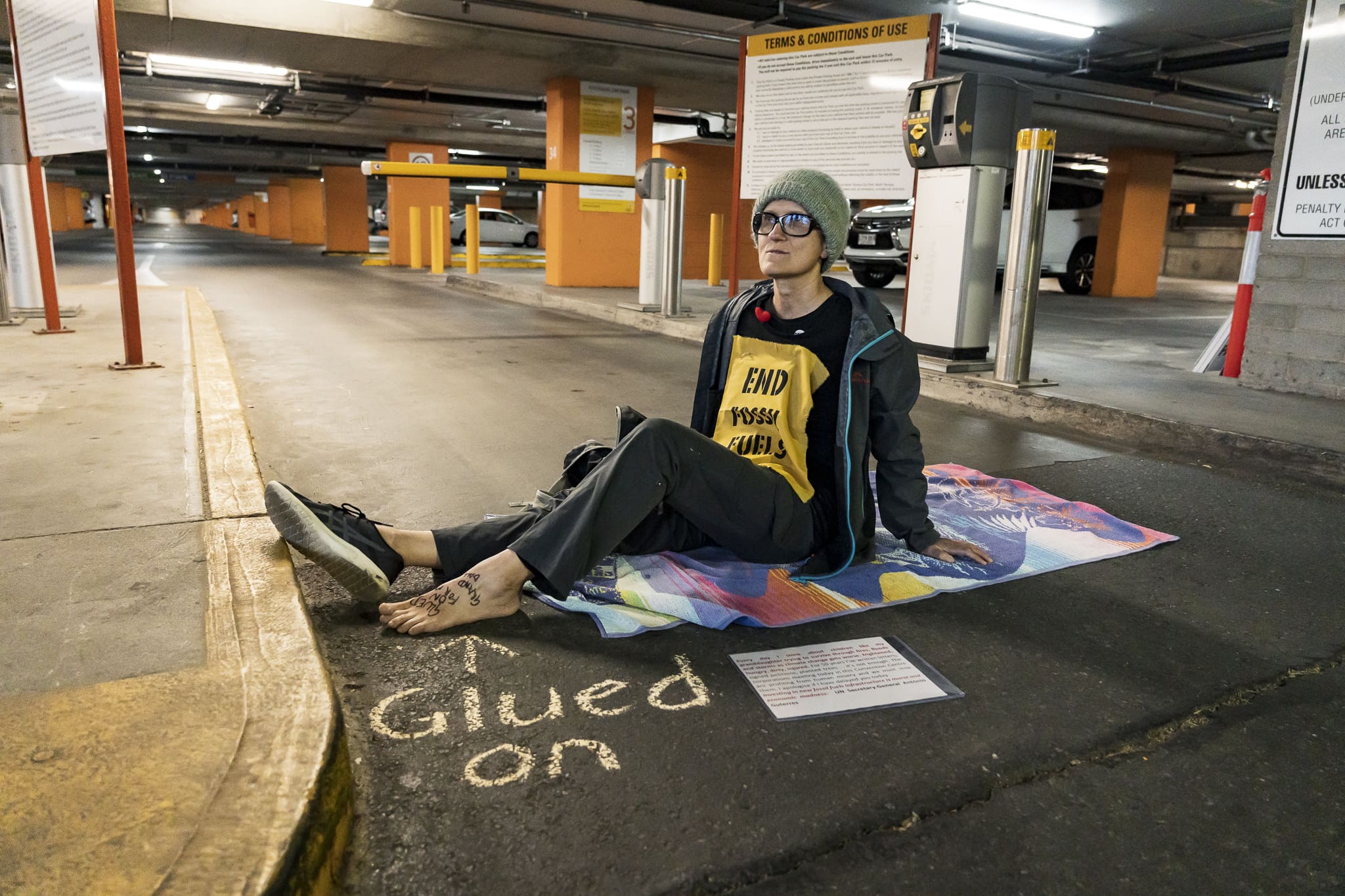 Activists glued on at the car park entrances to the Adelaide Convention Centre. Photo: Matt Hrkac