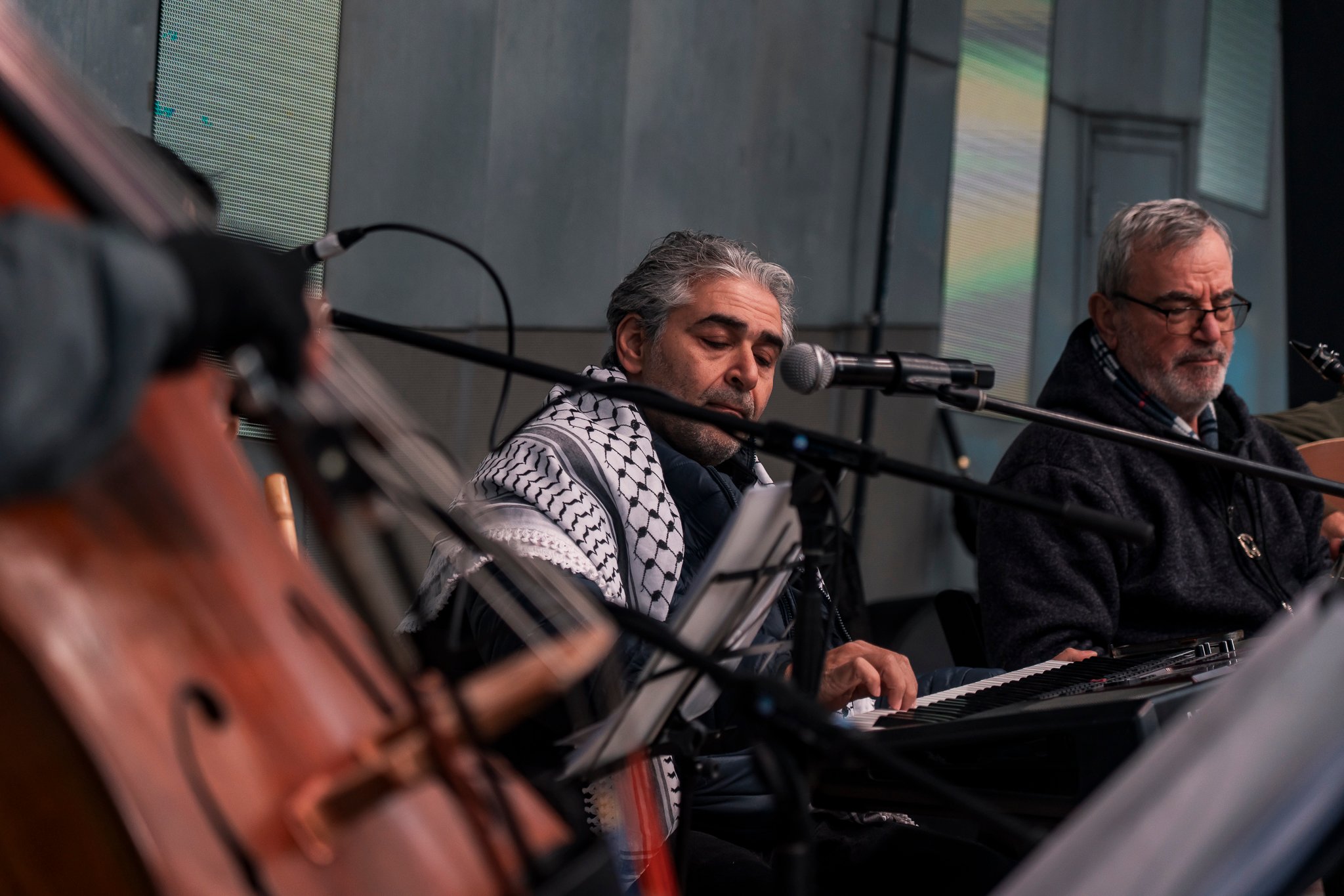 Arab classical music orchestra Tarab Ensemble performs on stage.