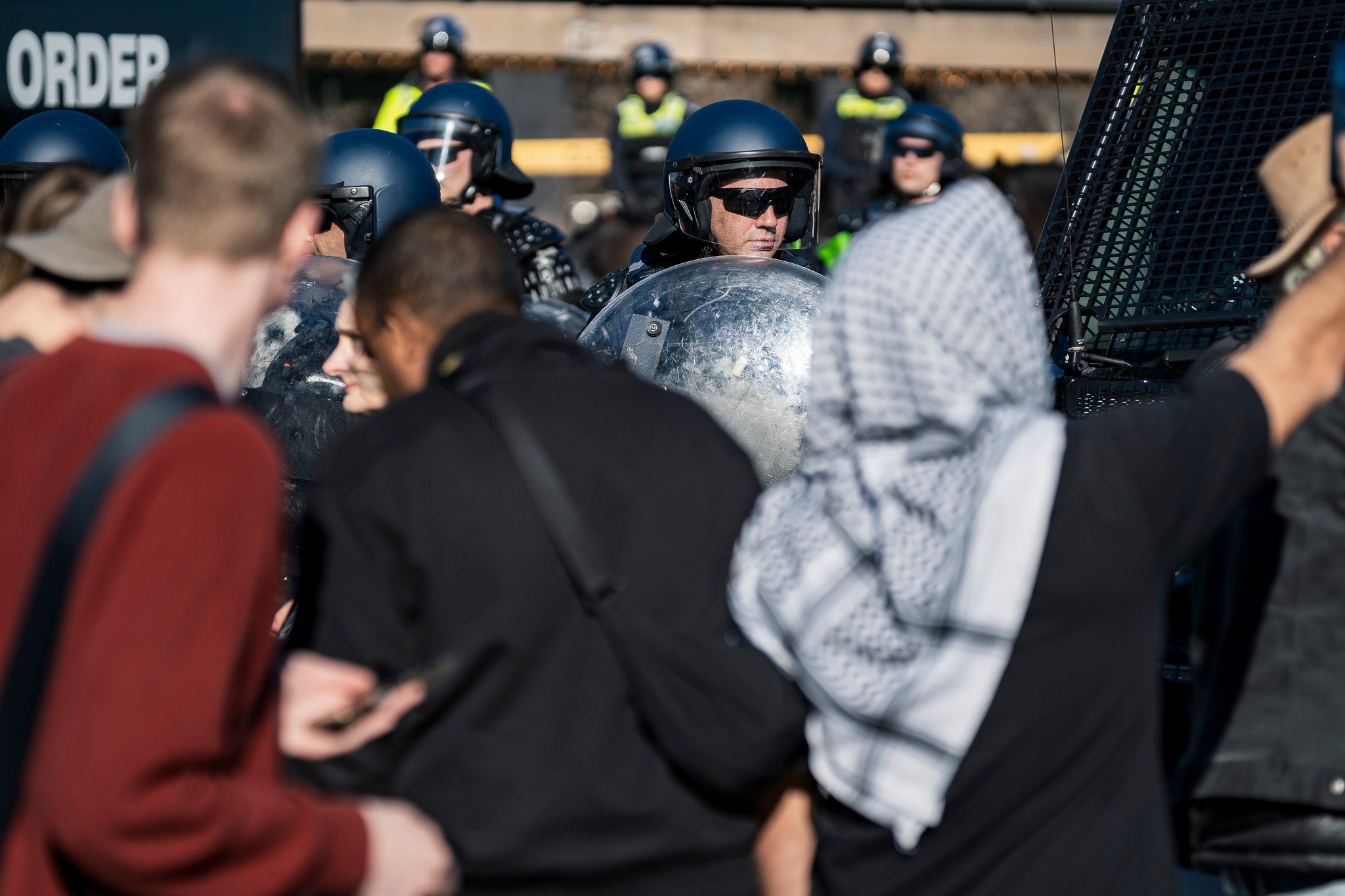 The march was met with dozens of Public Order Response Team (PORT) members in riot control gear.