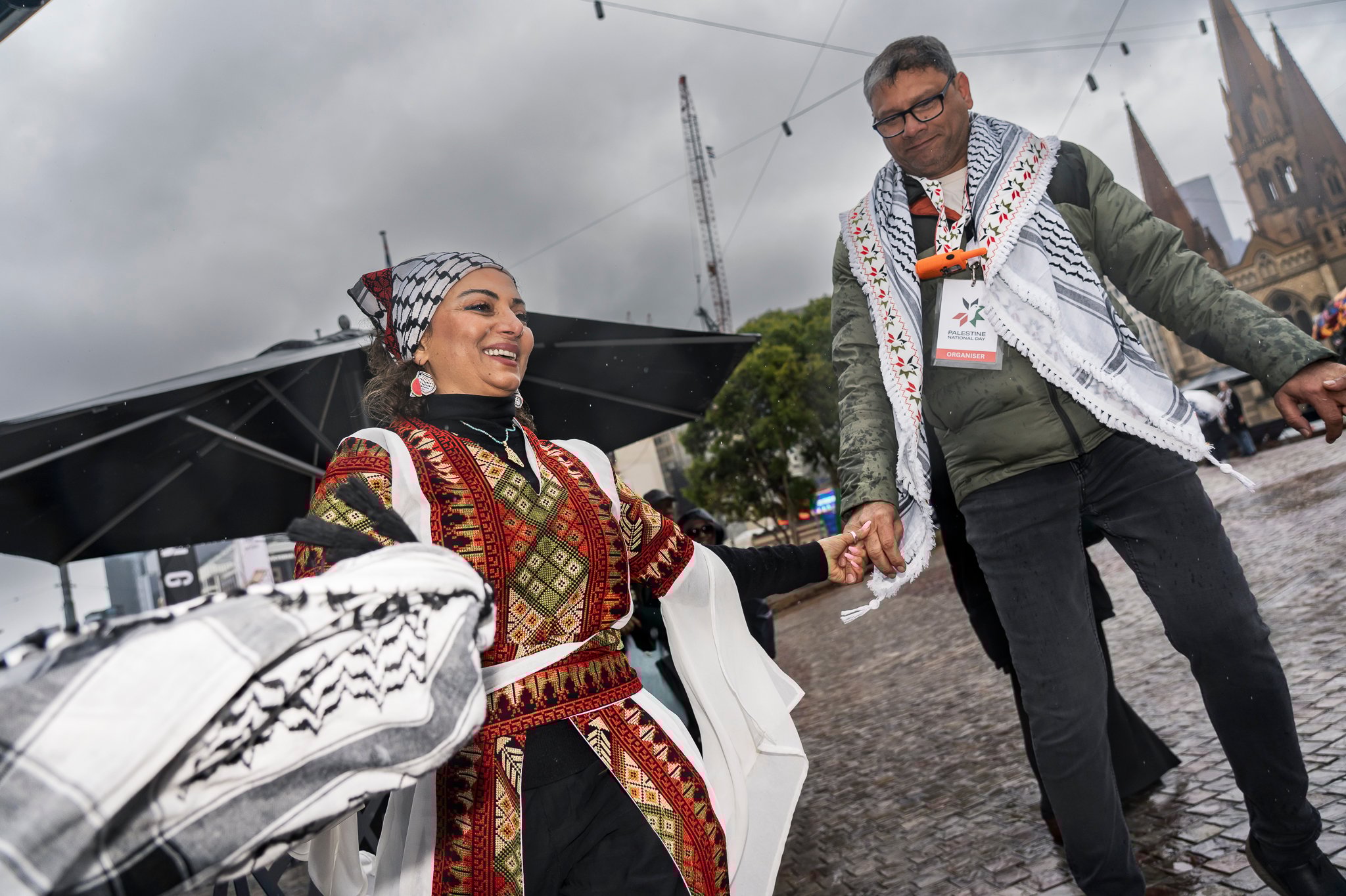Amin Abbas does a dabke class for attendees, which was well engaged with despite the rain.