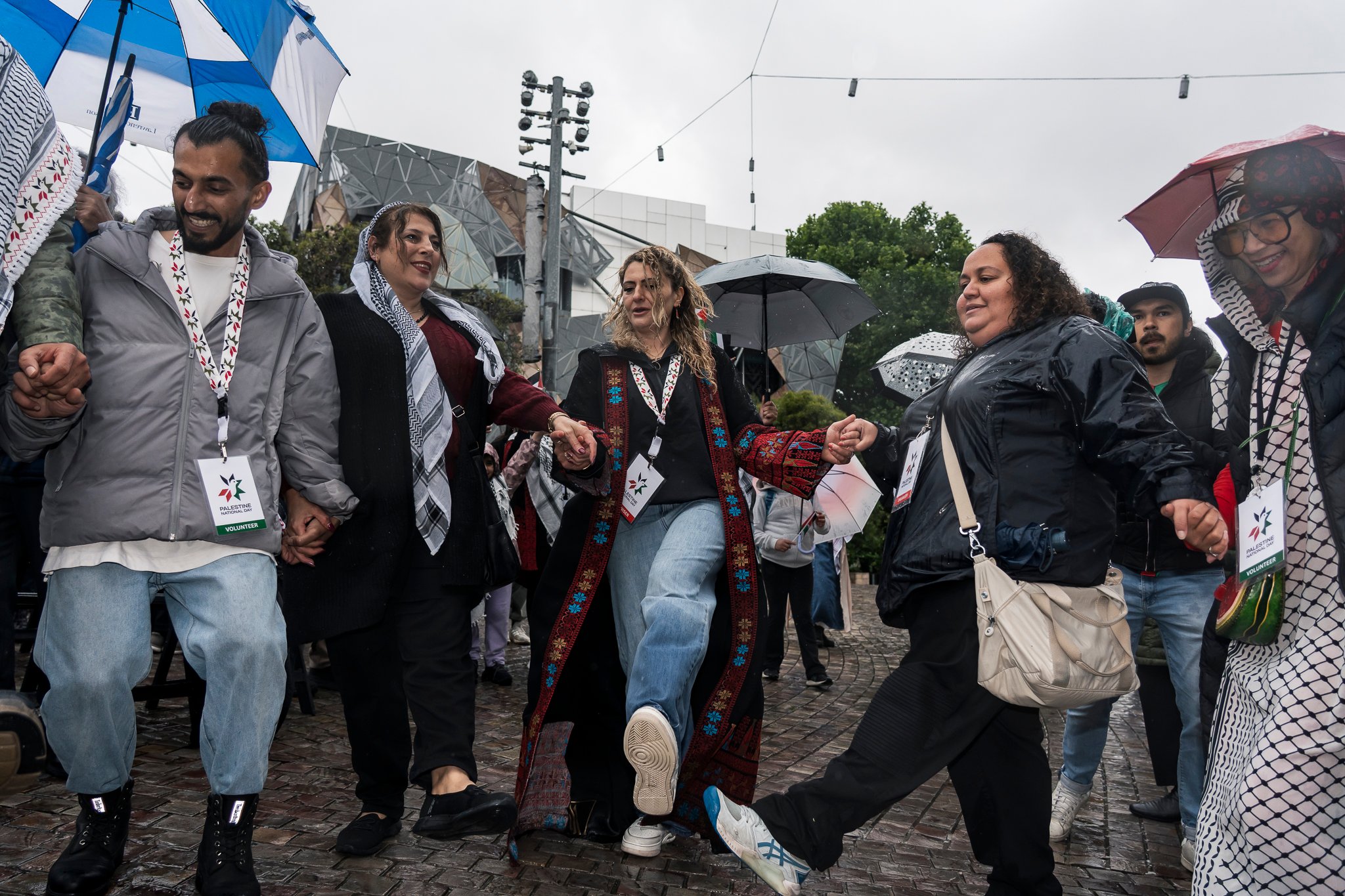 Amin Abbas does a dabke class for attendees, which was well engaged with despite the rain.