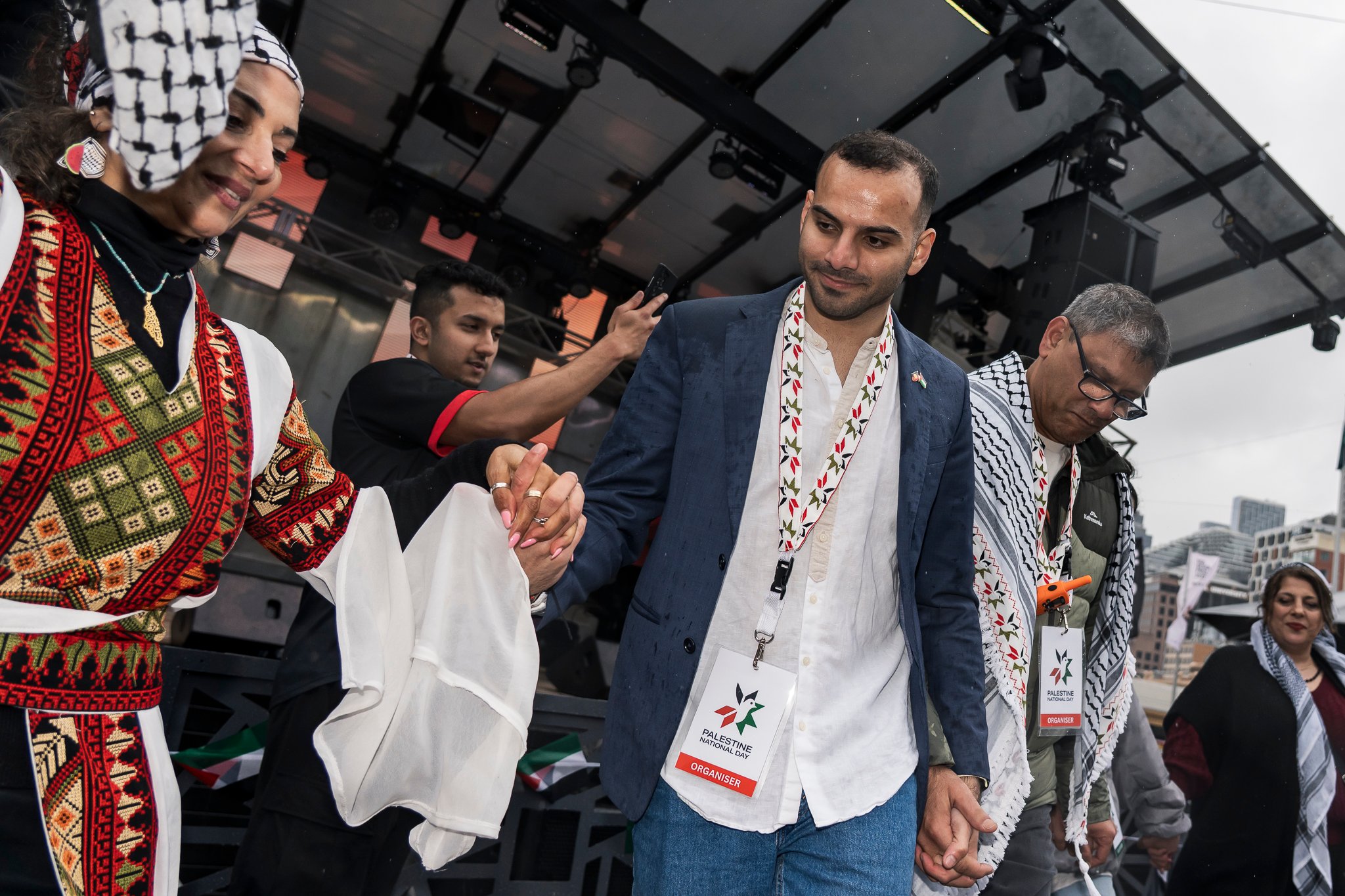 Amin Abbas does a dabke class for attendees, which was well engaged with despite the rain.