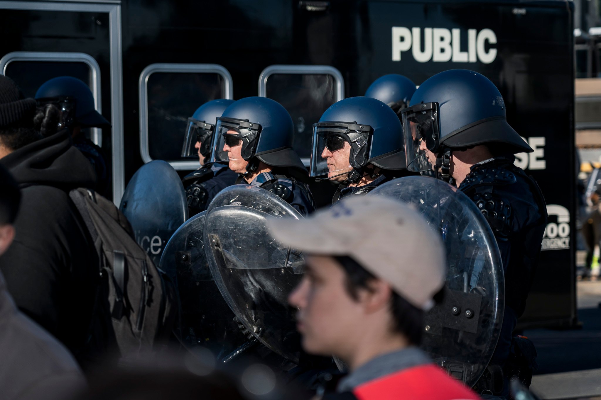The march was met with dozens of Public Order Response Team (PORT) members in riot control gear.