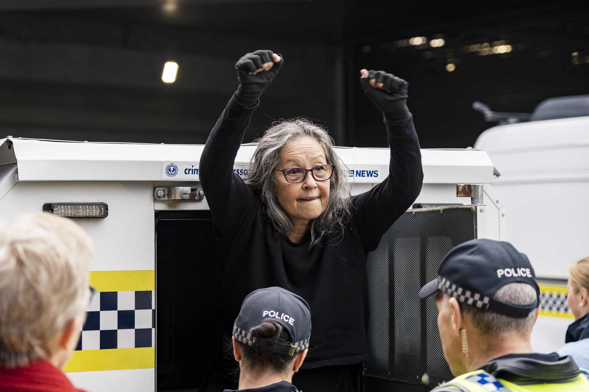 The activist is arrested and taken into custody after holding up traffic for more than 90 minutes. Photo: Matt Hrkac