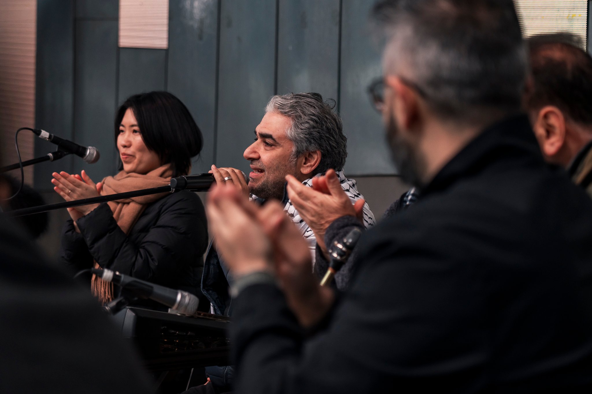 Arab classical music orchestra Tarab Ensemble performs on stage.