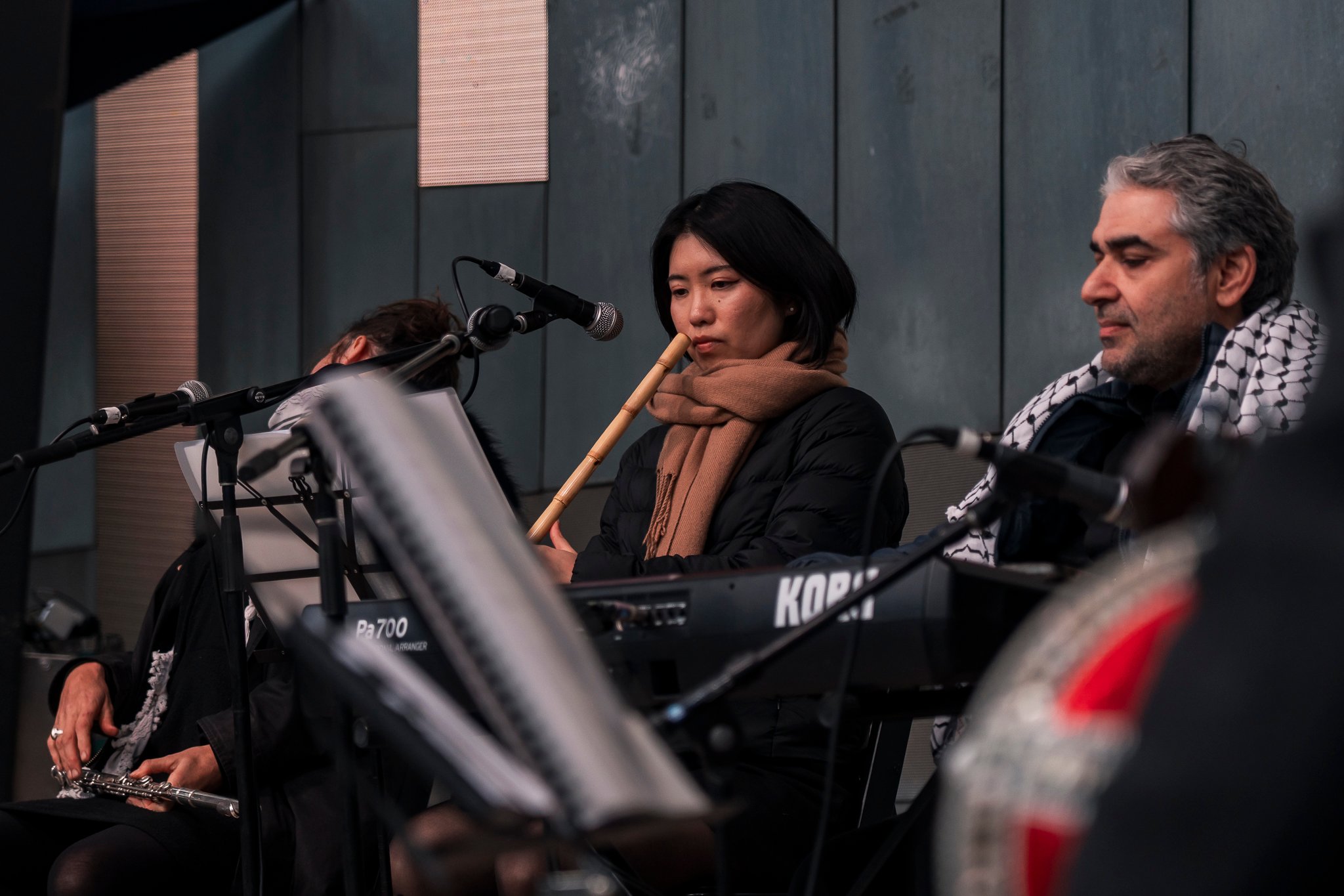 Arab classical music orchestra Tarab Ensemble performs on stage.