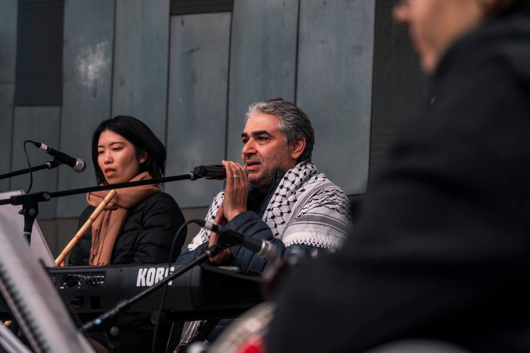 Arab classical music orchestra Tarab Ensemble performs on stage.