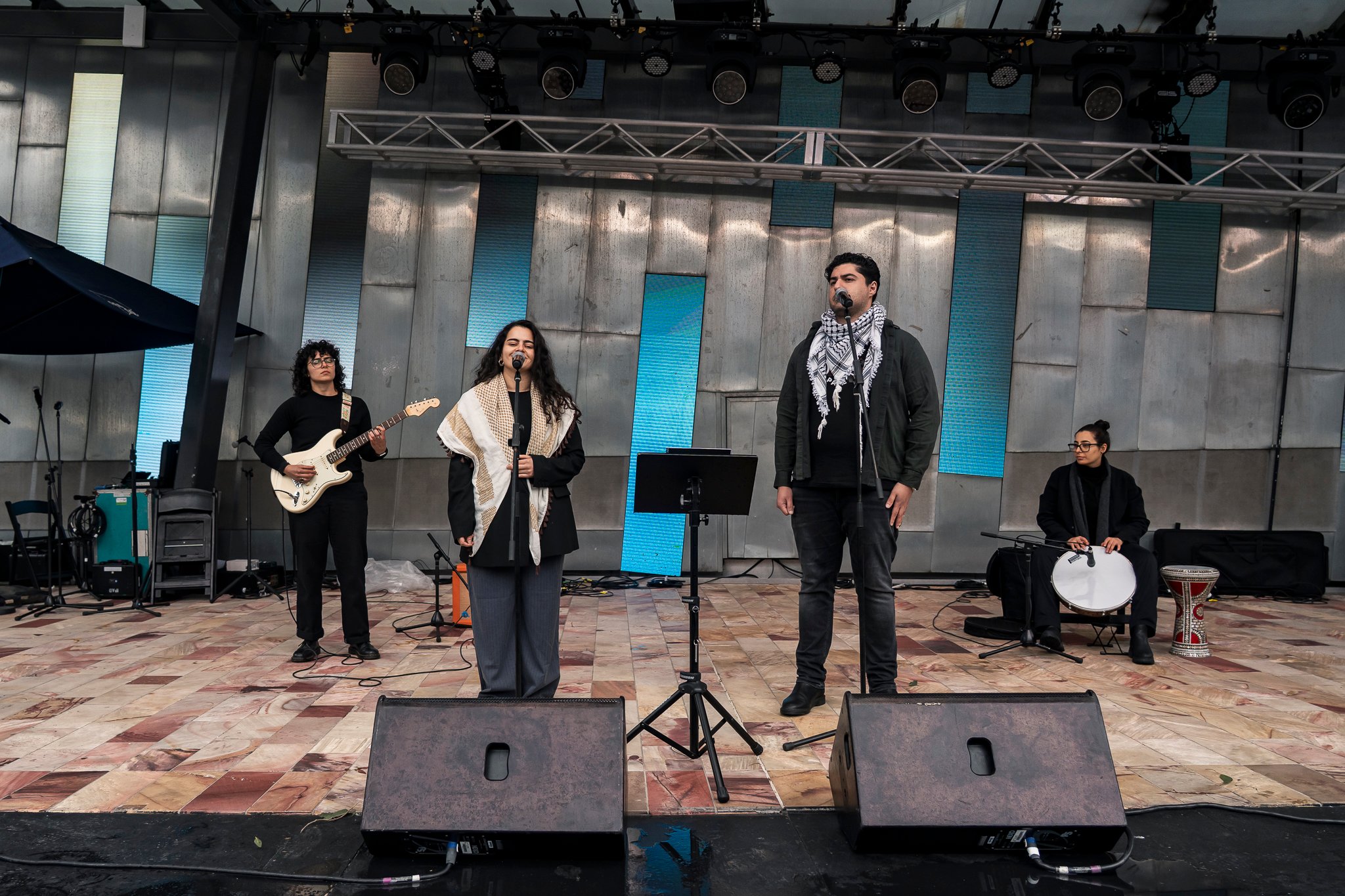 Arab music band Watar Music Ensemble performs on stage.