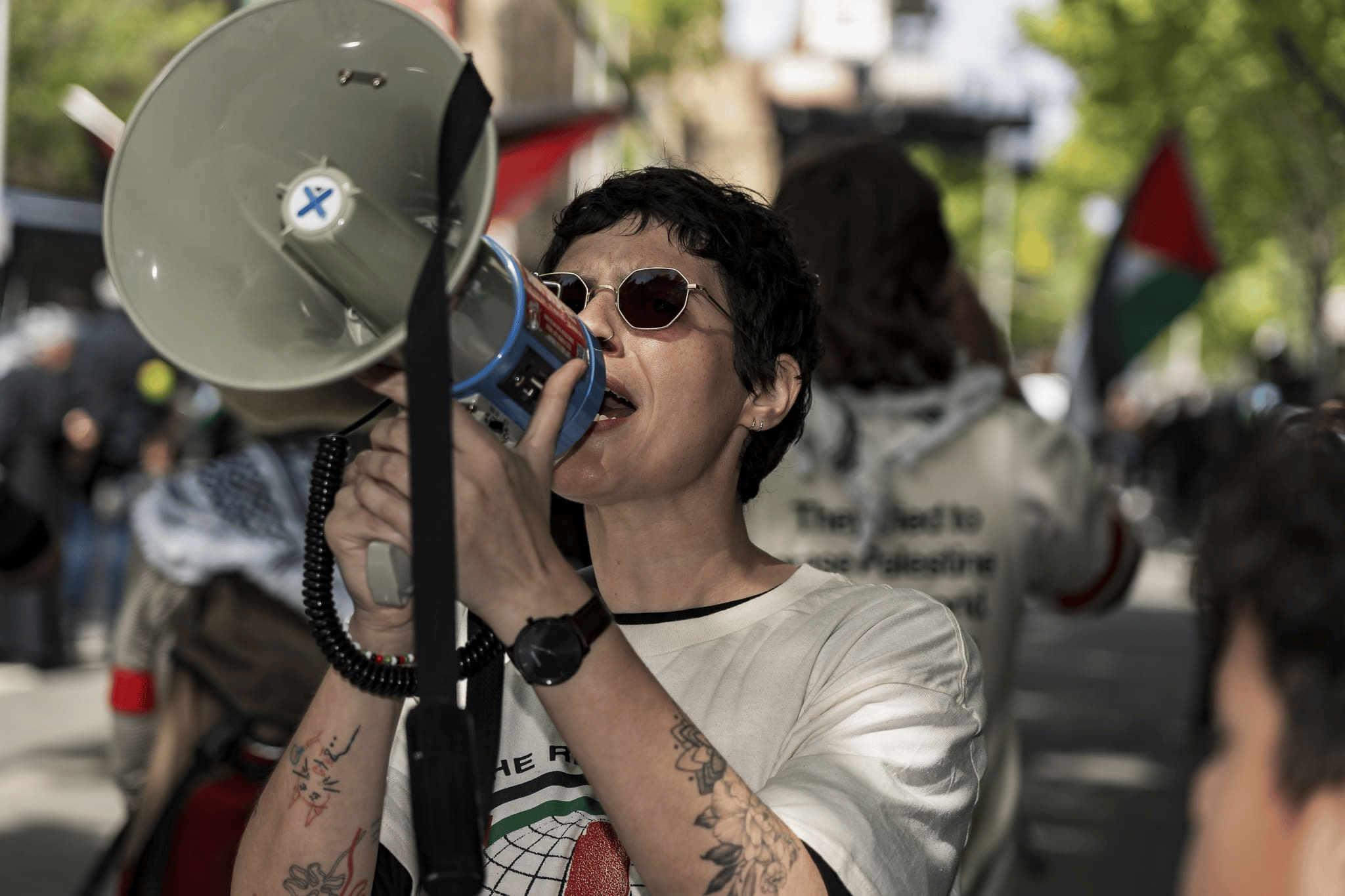 A protester leading chants at a rally. Photo: Matt Hrkac