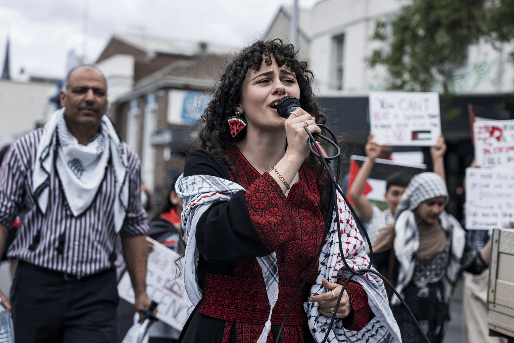 A protester leading chants at a rally. Photo: Matt Hrkac
