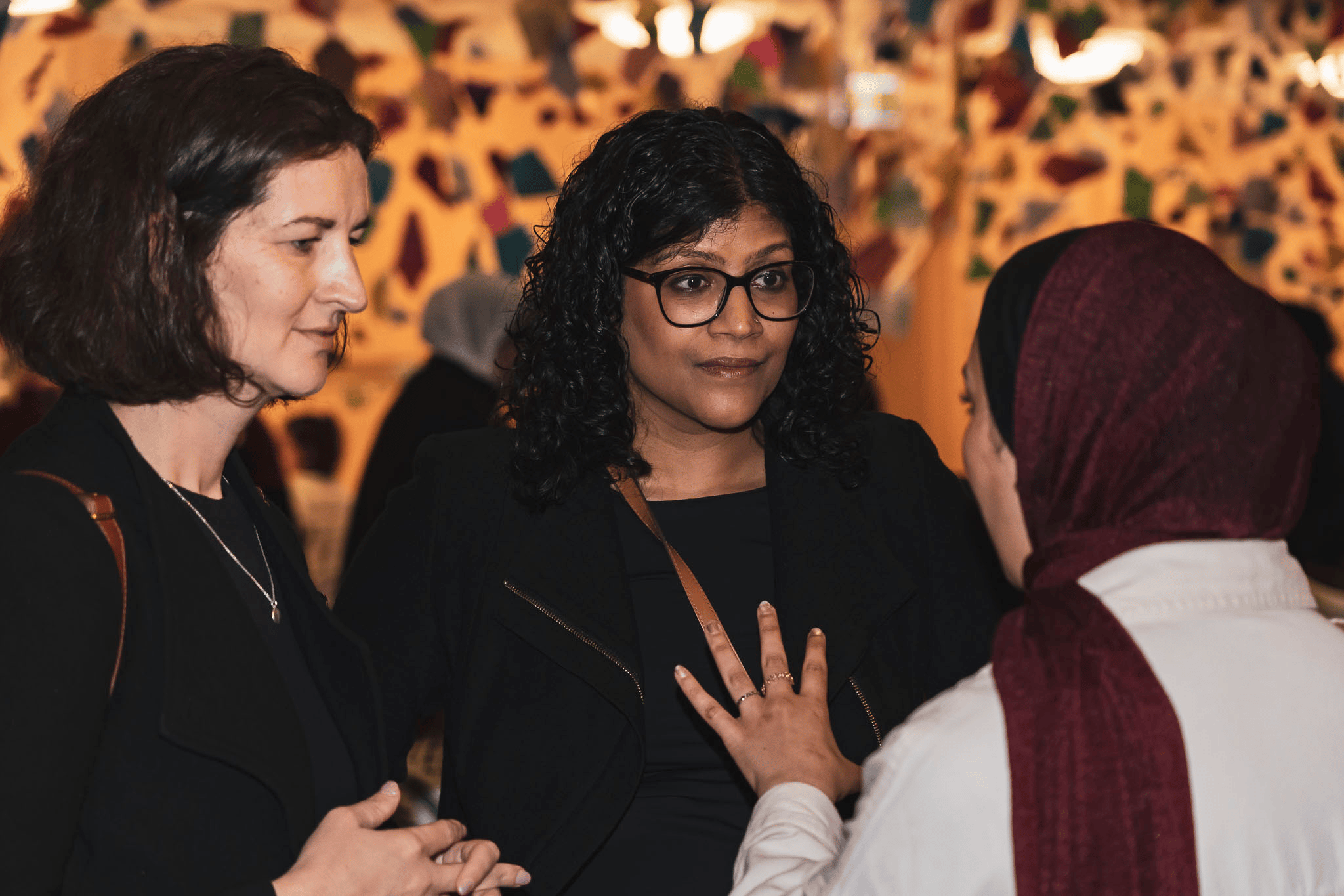 Victorian Greens leader Ellen Sandell, and Samantha Ratnam, engages with attendees at the vigil.