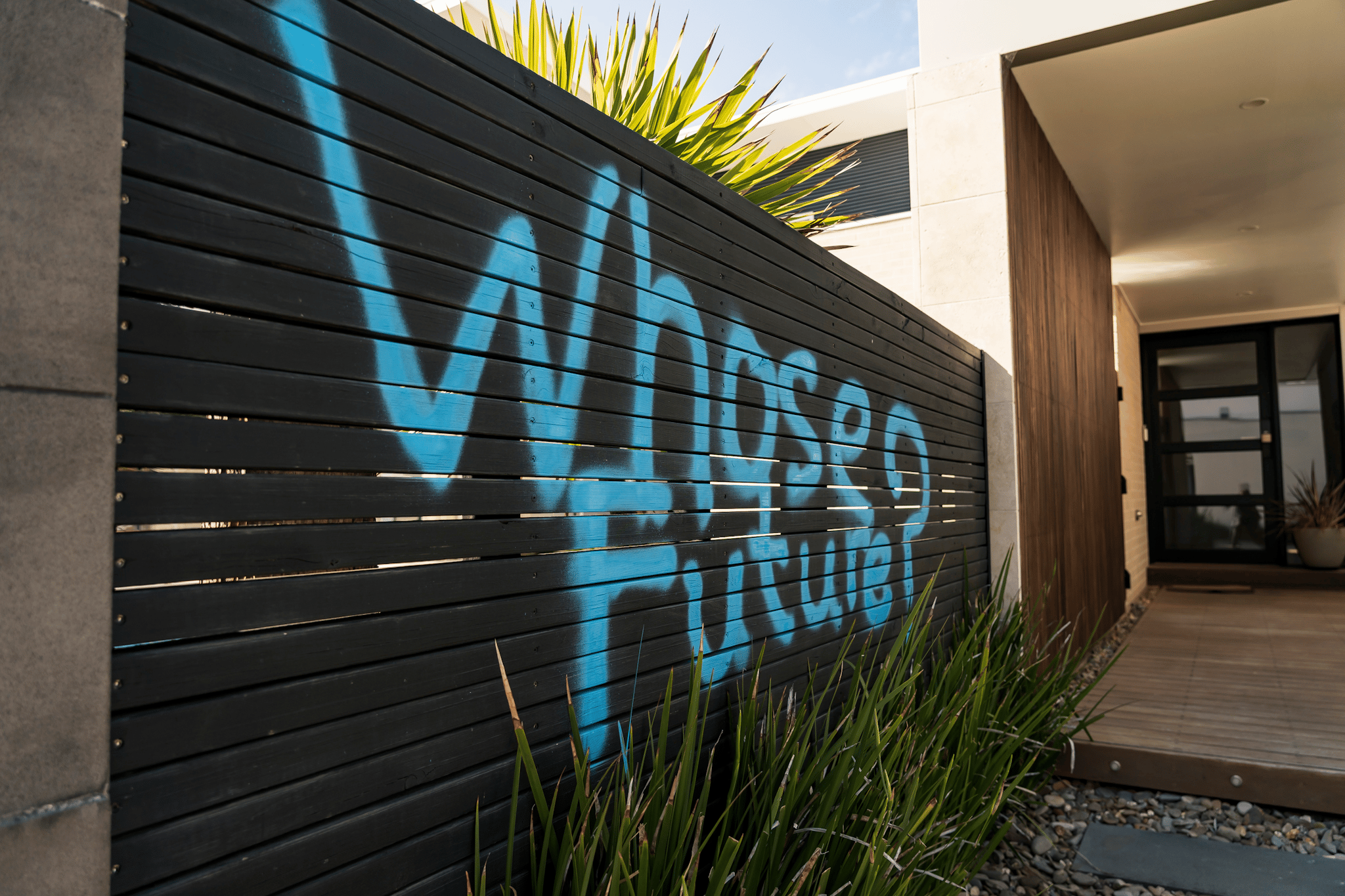 Protesters occupy the rooftop of the home of Viva Energy CEO Scott Wyatt