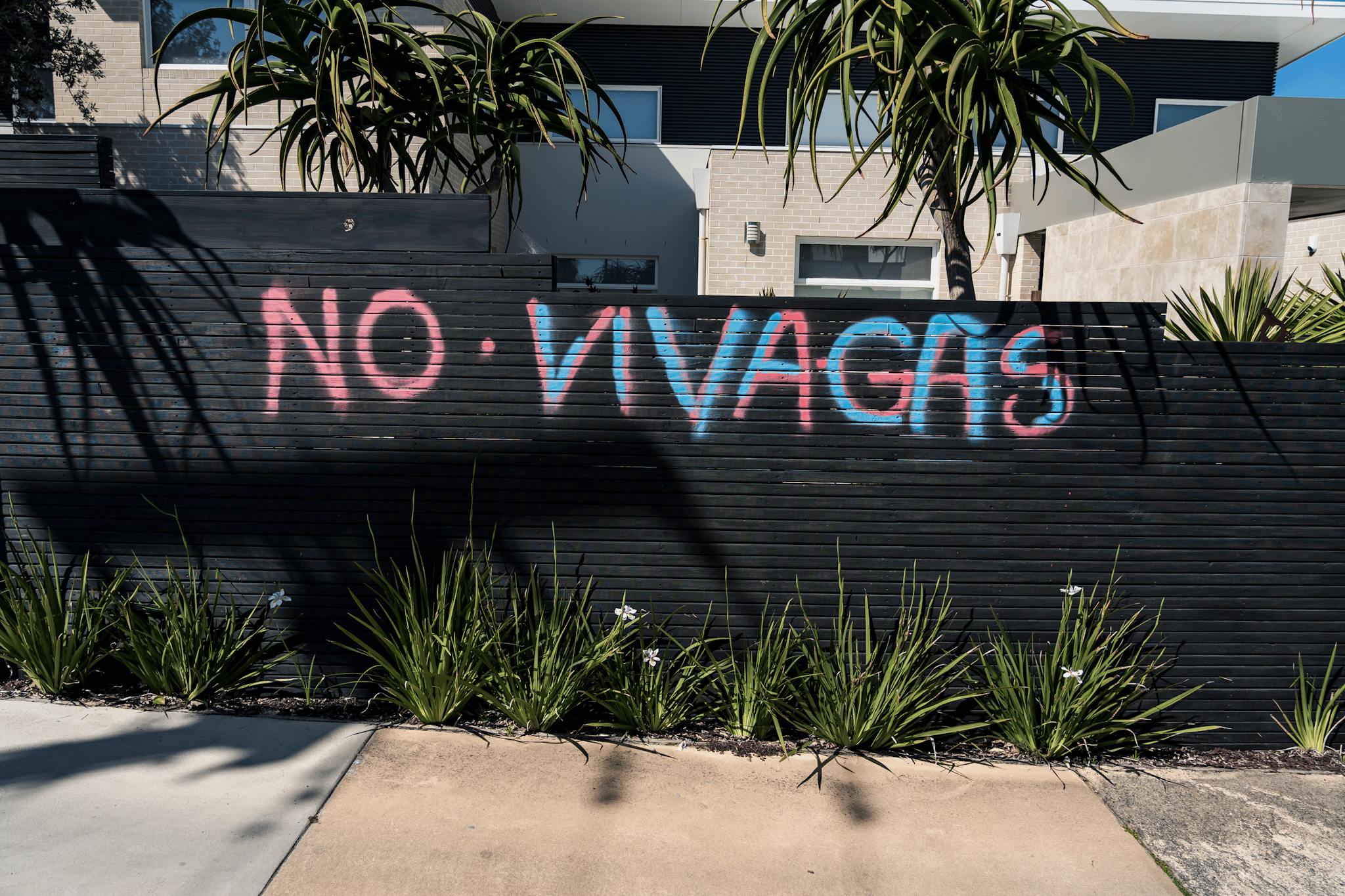 Protesters occupy the rooftop of the home of Viva Energy CEO Scott Wyatt