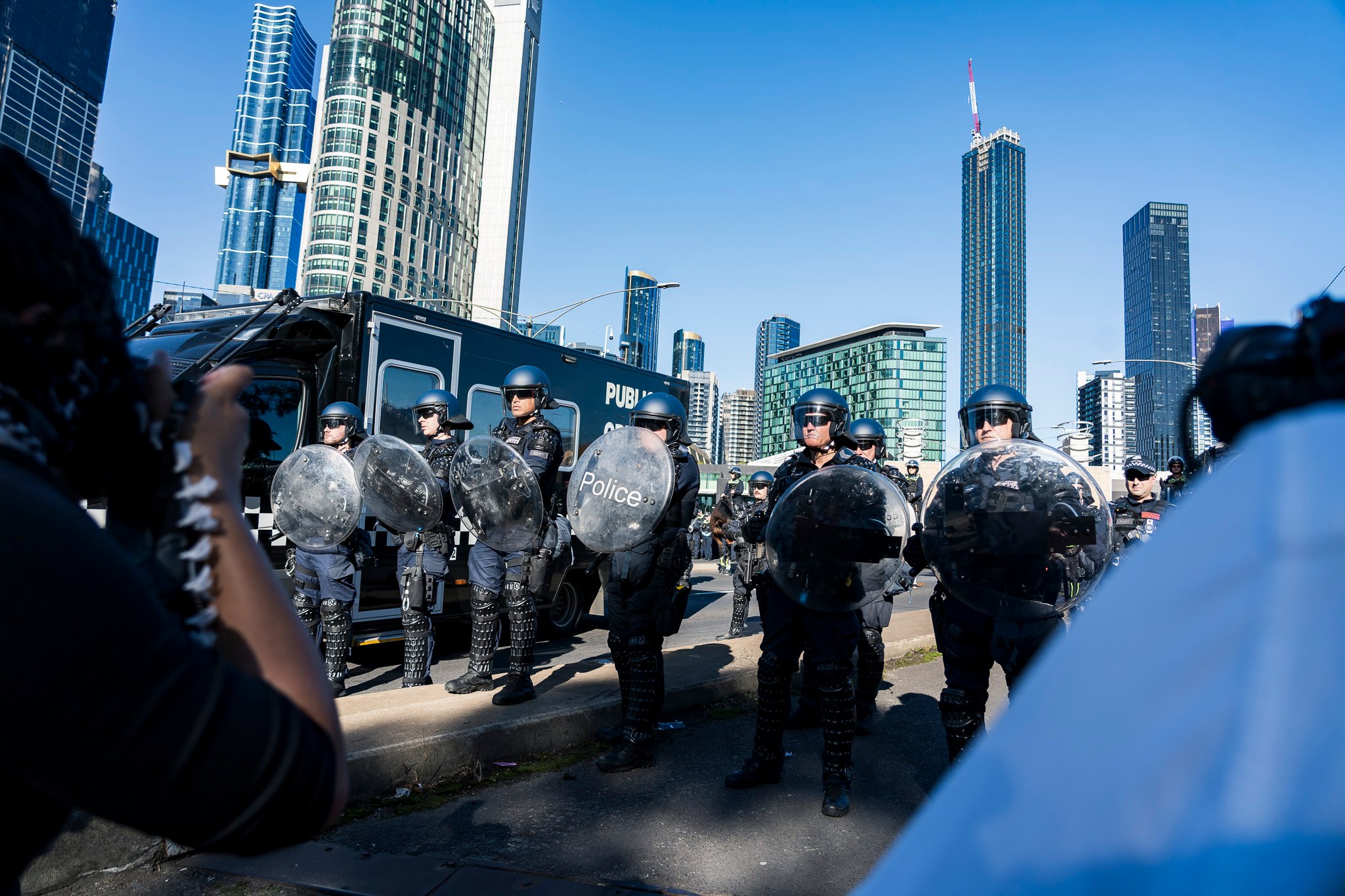 The march was met with dozens of Public Order Response Team (PORT) members in riot control gear.