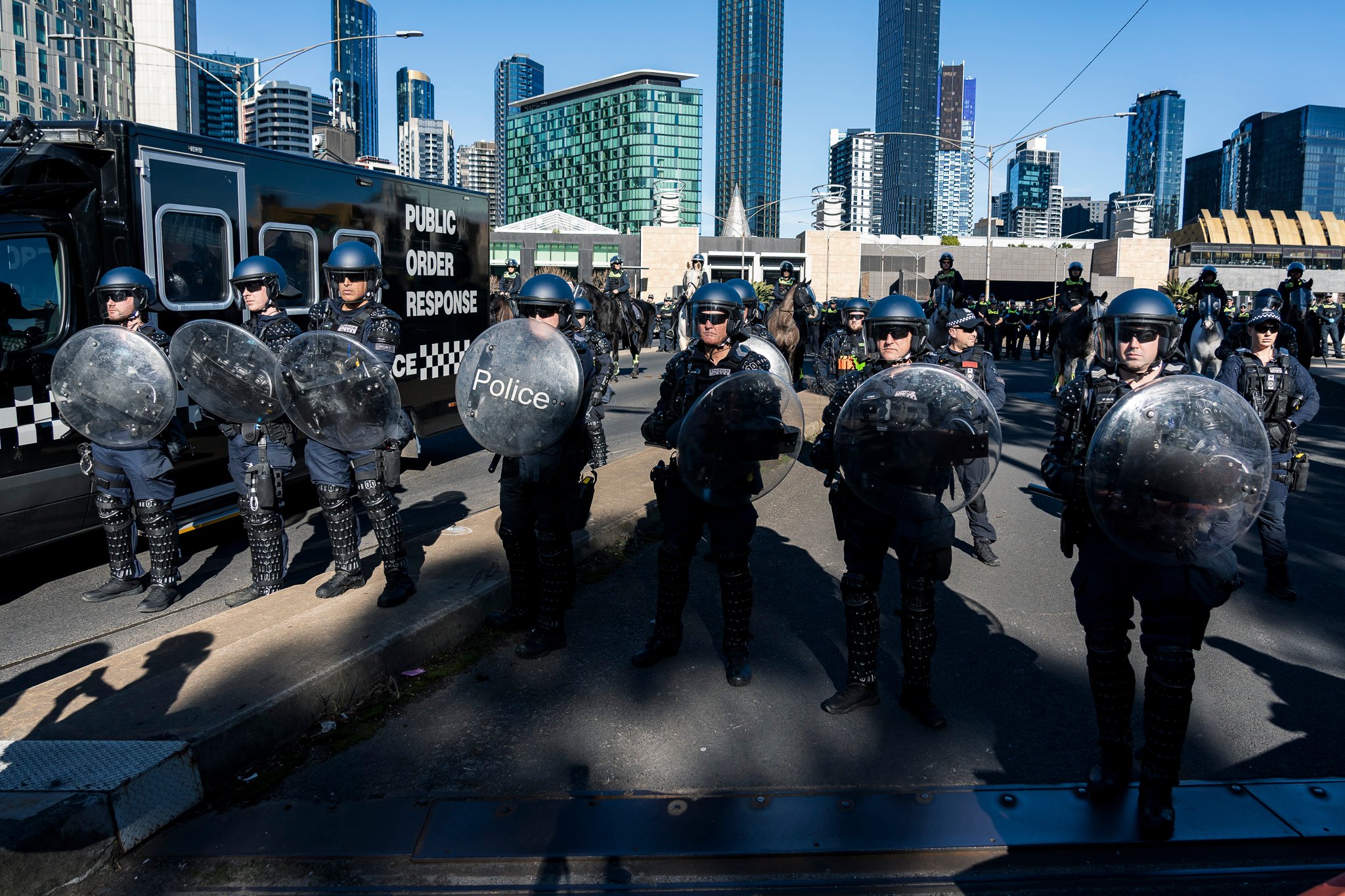 The march was met with dozens of Public Order Response Team (PORT) members in riot control gear.