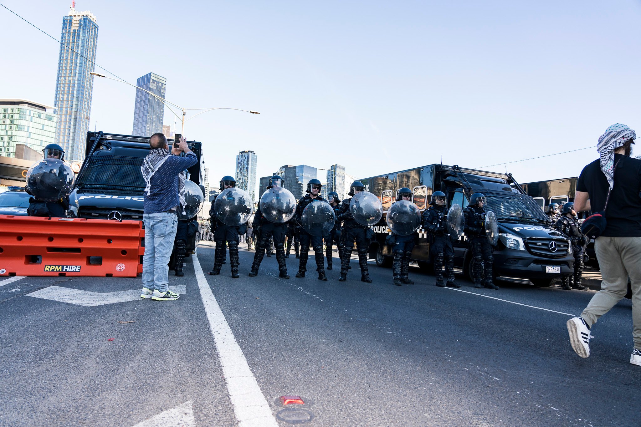 The march was met with dozens of Public Order Response Team (PORT) members in riot control gear.