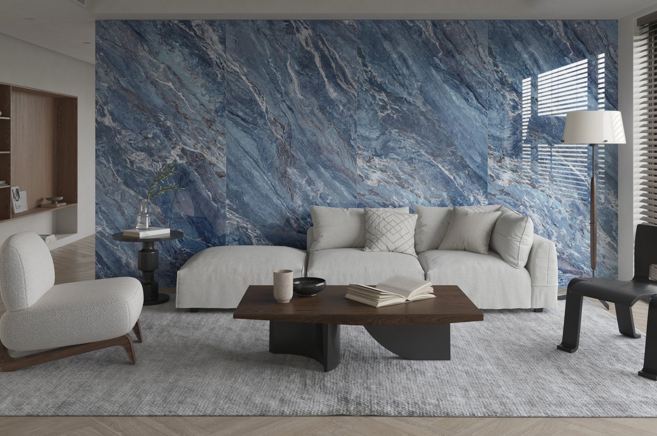 Stone-look wall panels behind a sofa in a residential interior