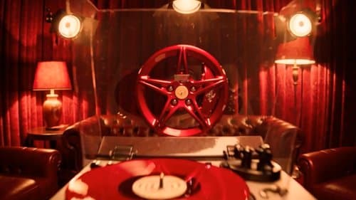 Red velvet listening room with a turntable built into a sports-car wheel
