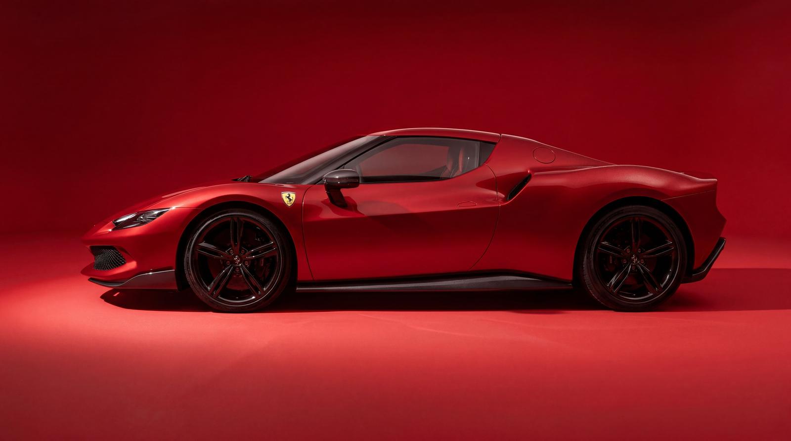 Red Ferrari sports car in side profile with black wheels against a matching red studio background