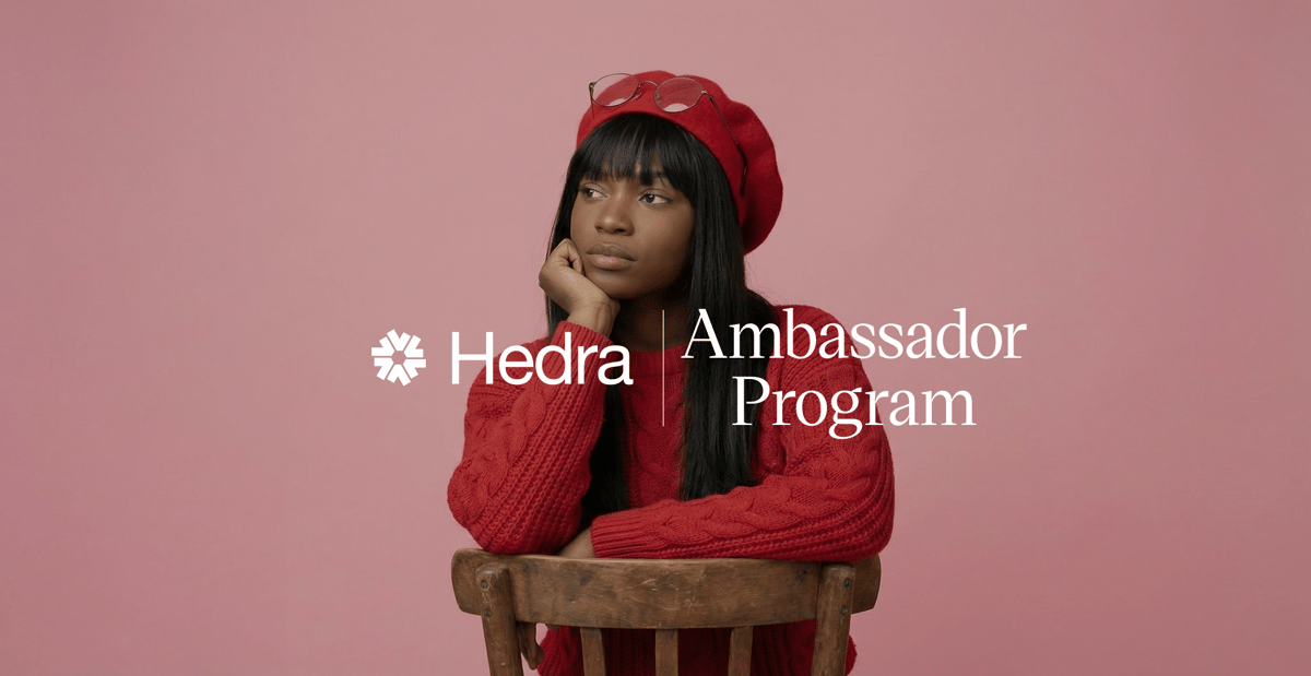 Woman in red beret and sweater rests chin on hand behind a chair on pink backdrop, with text "Hedra Ambassador Program"