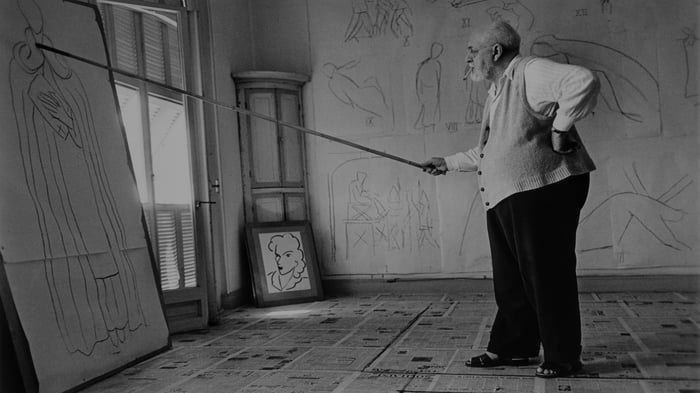 Henri Matisse working in his studio in Vence