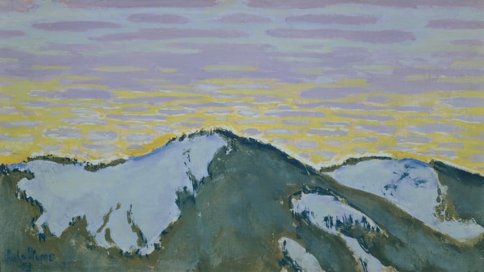 Snow-covered mountain peaks at dusk