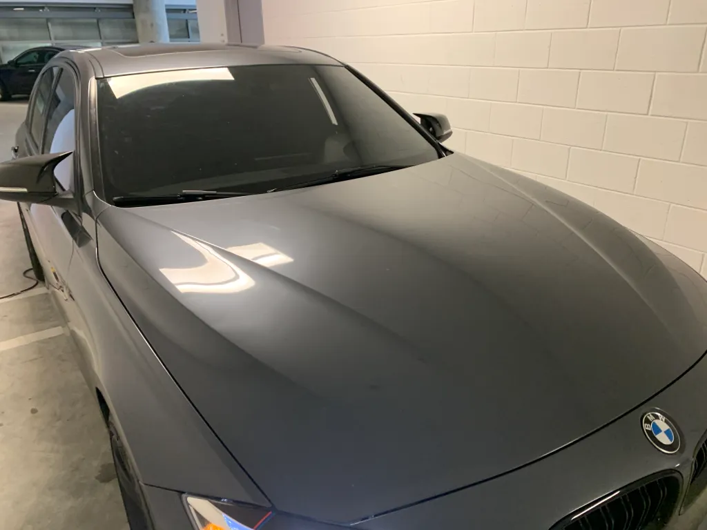 Tinted BMW in a parking garage