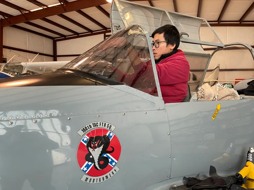 Installer working on an airplane cockpit