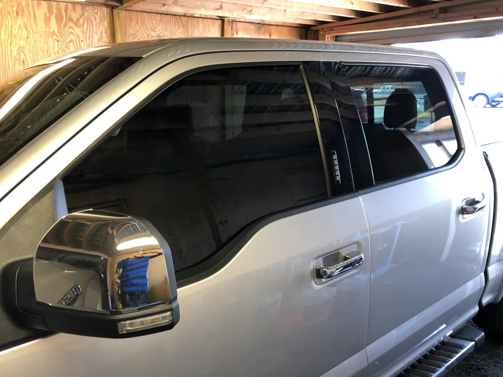 Close up of tint on a silver Ford F-150