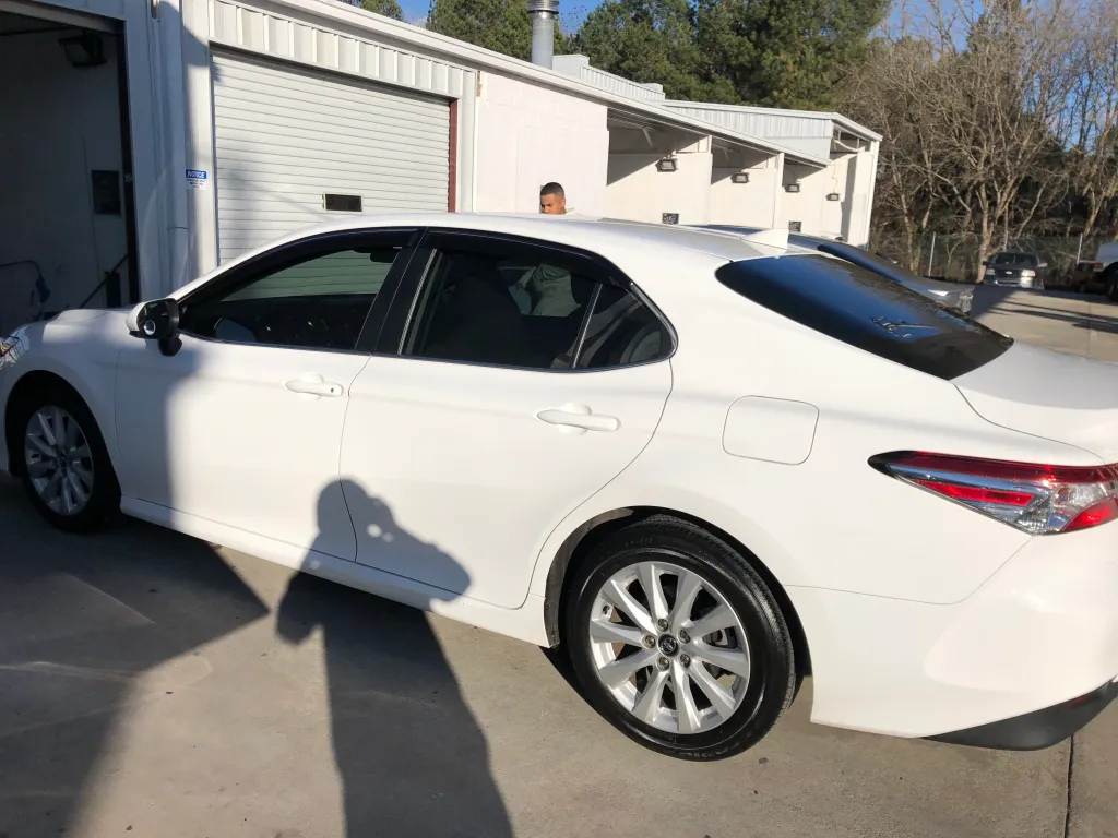 White Toyota Camry with ceramic window tint - professional mobile service