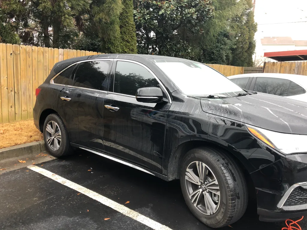 Black SUV with ceramic window film - professional mobile tinting service