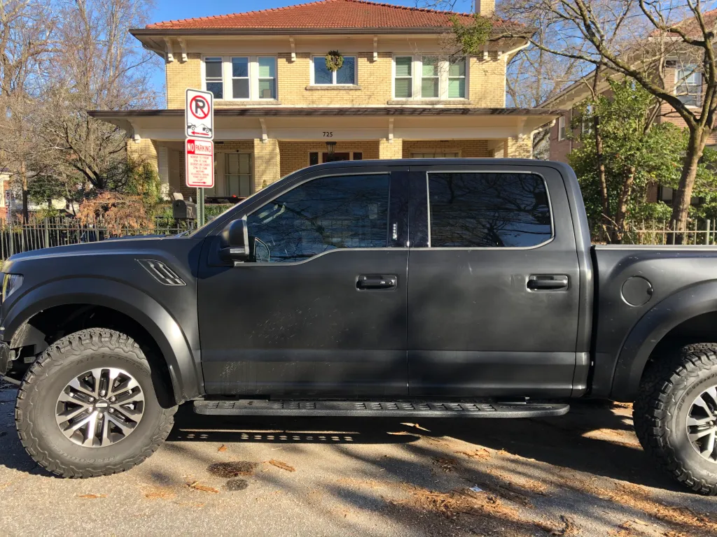 Ford F-150 Raptor pickup truck with professional window tinting